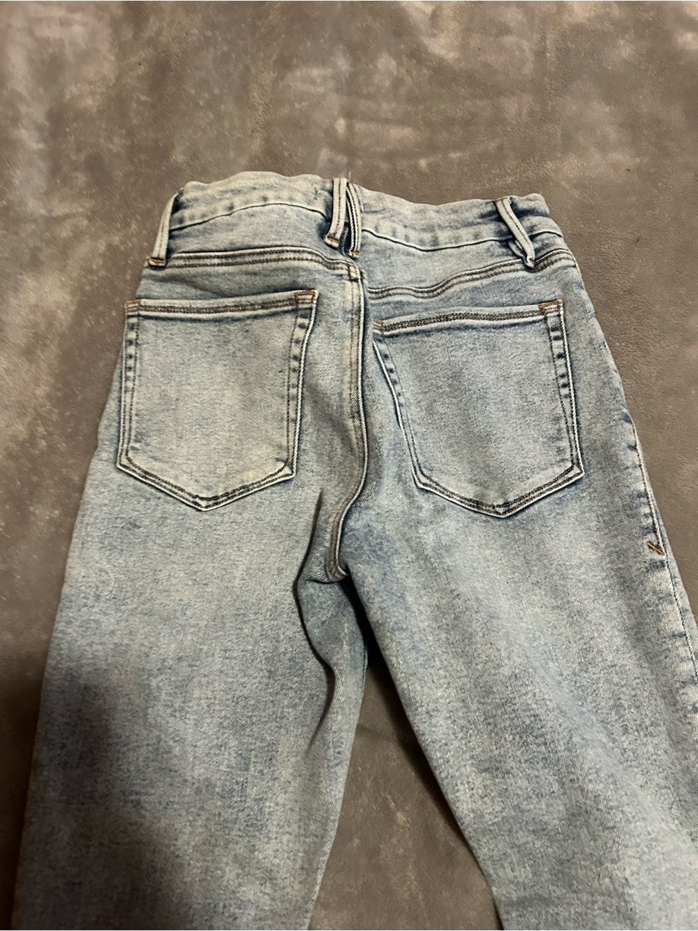 Good American Light Blue Washed Denim Jeans with Faded Detail